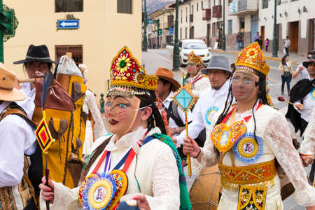 Cusco, Peru - october 08, 2018: People take part in the religious parade of the Virgin of the Rosary and walk in the historic center of Cusco in traditional masks and dresses, in Cusco, Peru.のeditorial素材