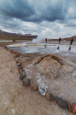 San Pedro de Atacama, Chile - October 14, 2019: people watch amazing El Tatio geysers at sunrise, near San Pedro de Atacama, Chile.のeditorial素材