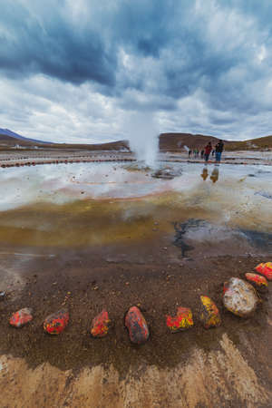 San Pedro de Atacama, Chile - October 14, 2019: people watch amazing El Tatio geysers at sunrise, near San Pedro de Atacama, Chile.のeditorial素材