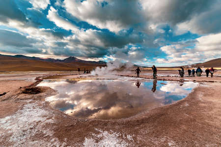 San Pedro de Atacama, Chile - October 14, 2019: people watch amazing El Tatio geysers at sunrise, near San Pedro de Atacama, Chile.のeditorial素材