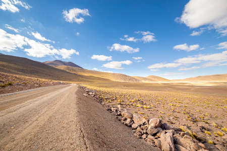 View from the Route B 245 at sunrise, a scenic road in the north of Chile. The road runs from San Pedro de Atacama to El Tatio Geysers, near the border with Bolivia.の写真素材