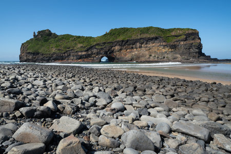 The Hole in the Wall, an extraordinary natural arch on the Indian Ocean, in the Eastern Cape, on the Wild Coast, South Africaの写真素材