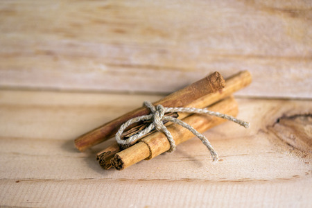 Cinnamon bundle on wooden backgroundの写真素材