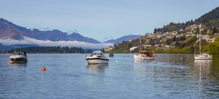 Morning in Queenstown, boats on Wakatipu lake, New Zealandの写真素材