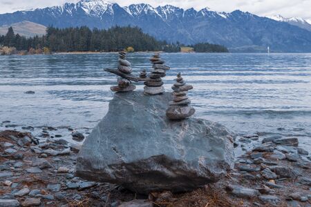 Balance stone pyramid  by Wakatipu lake, Queenstown, New zealandの写真素材