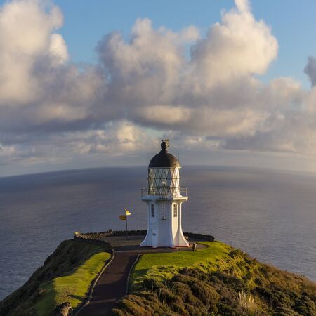 Cape Reinga lighthouse, north edge of New Zealand, Tasman sea and Pacific oceans meet here.の写真素材