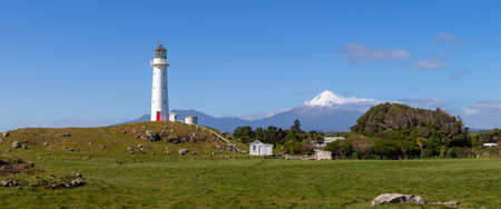 Taranaki volcano and Cape Egmont lighthouse panorama, New Zealandの写真素材