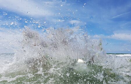 Waves in the sea and clouds in the sky
