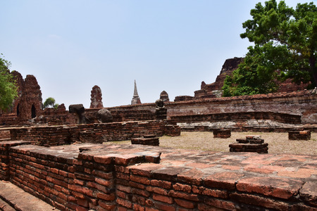 Ruins of stupa and statue of Buddha in Wat Mahathat, the ancient Thai temple in Ayutthaya Historical Park. Was built in 1374の写真素材