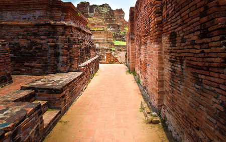 Ruins of stupa and statue of Buddha in Wat Mahathat, the ancient Thai temple in Ayutthaya Historical Park. Was built in 1374の写真素材