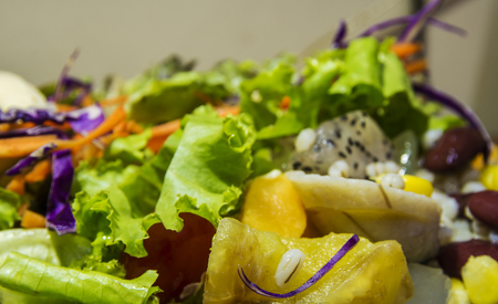 Closeup mixed of fresh salad and fruit. Corn, red beans, pineapple and papaya.の写真素材