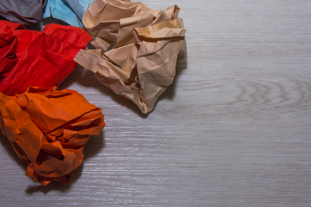 Colorful paper on white wooden background.の写真素材