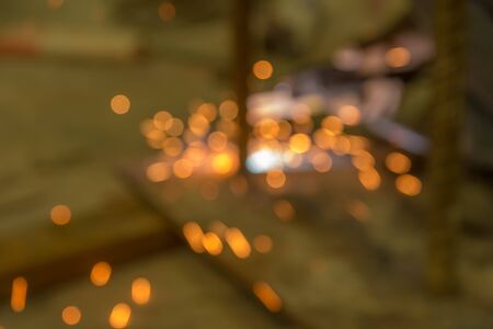 Abstract light background of sparks from welding with bokeh.