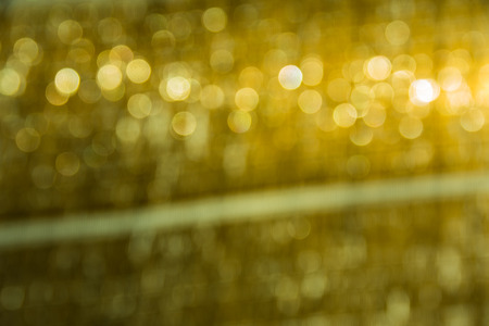 Abstract blurred bokeh lights and yellow for background.