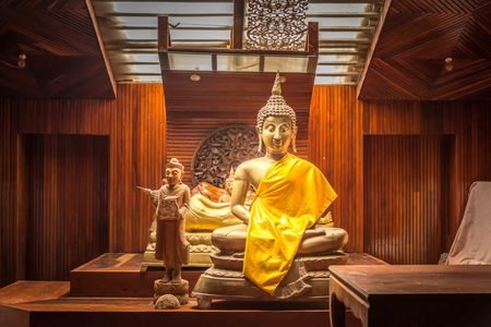 Buddha statue made of wood and brass Located in the temple. Wood carving.のeditorial素材