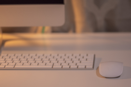 Mouse and keyboard on white table in office.の写真素材