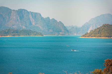 Landscape of Choew Lan Dam or Ratchaprapa Dam beautiful lake and mountains the dream land of travellers in Khao Sok National Park,Surat Thani,Thailand.の写真素材