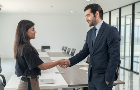 Business people shaking hands after success meeting in office,Businessman smile and shack hand with...