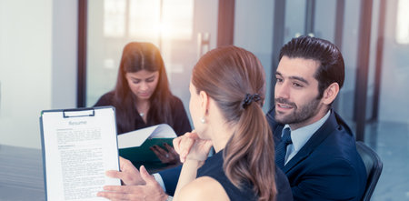 Business concept and job interviews, businessman asking of job interviews for Asian applicants at the office. HR and management are reviewing the resumes of women applying for jobsの写真素材