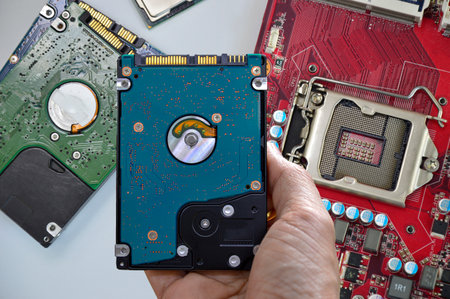 Hard disk drives are still widely used. hard drive in handの写真素材