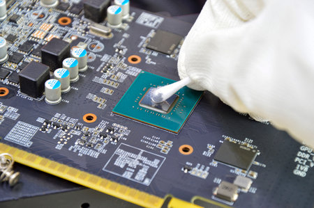 Image of technician cleaning the CPU chip.の写真素材
