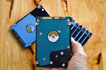 Hard disk drives are still widely used. hard drive in handの写真素材