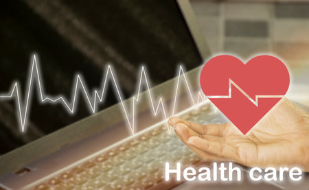 red hand and heart icon, health care conceptの写真素材