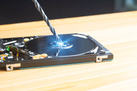 Hard drive being hacked, system concept hacked.の写真素材