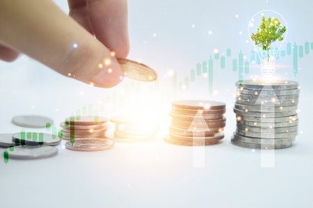 hands stacking coins on white background, concept business successの写真素材