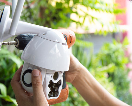 Man installing IP CCTV or high tech surveillance system CCTV systemの写真素材