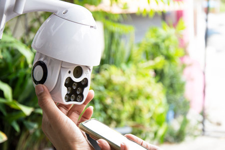 Man installing IP CCTV or high tech surveillance system CCTV systemの写真素材