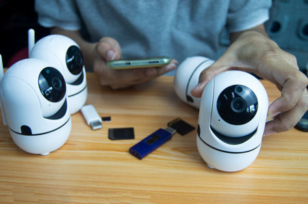 Conceptual man operating ip cameraの写真素材