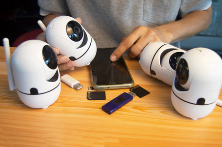 Conceptual man operating ip cameraの写真素材