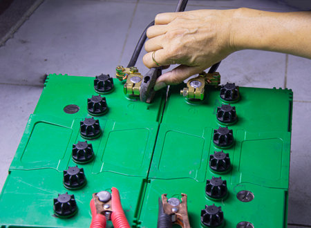 electrician connecting battery terminalsの写真素材