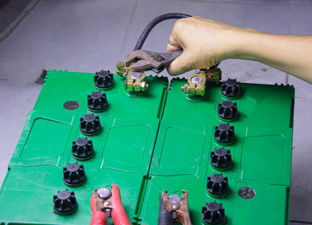 electrician connecting battery terminalsの写真素材