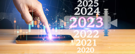 Businessman working with smartphone and virtual graphs, closeup. Financial trading concept