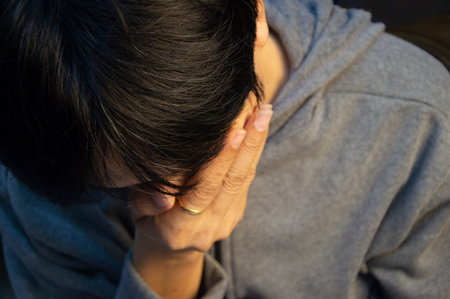 An Asian man in a state of sadness and disappointment.の写真素材