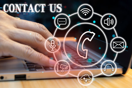 Contact us or our customer support hotline where people connect. and touch the contact icon on the virtual screenの写真素材