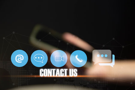 Contact us or our customer support hotline where people connect. and touch the contact icon on the virtual screenの写真素材