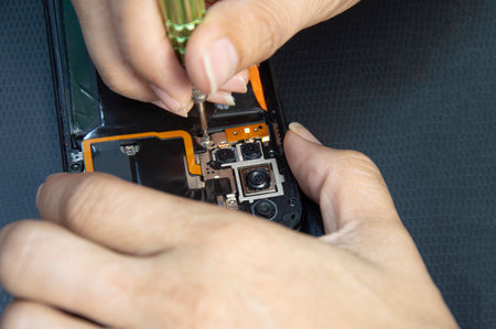 top view, mechanic repairing smartphoneの写真素材