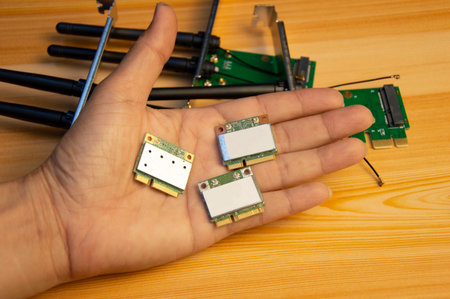Wi-Fi receiving card in hand, small card used to receive Wi-Fi signalの写真素材