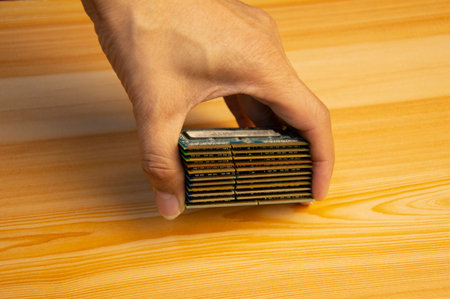 Many stacked laptop ram in hand,RAM is a hardware device. computer keyの写真素材