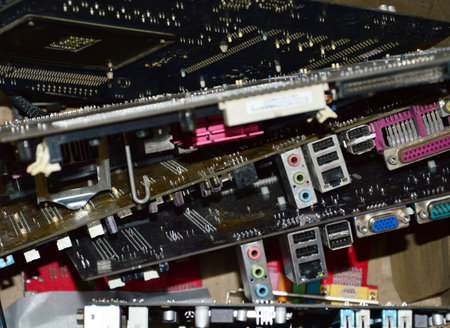 Computer motherboards stacked up waiting for recycling