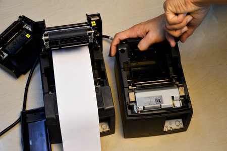Top view. Technician repairing printer, thermal printer.の写真素材