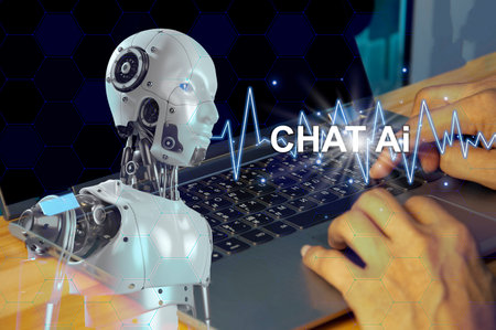 Chat Bot chats with AI or artificial intelligence technology. A person using a laptop computer is...