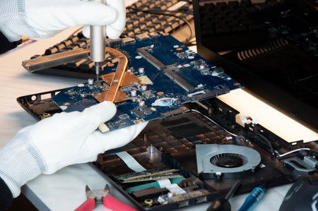 Side view of computer motherboard repairmanの写真素材