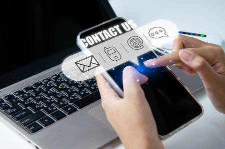 Contact us or our customer support hotline where people connect. and touch the contact icon on the virtual screenの写真素材