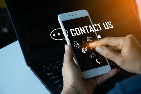 Contact us or our customer support hotline where people connect. and touch the contact icon on the virtual screenの写真素材