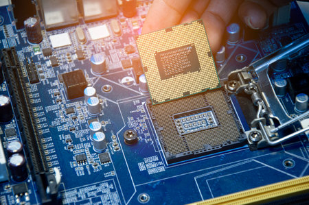 Side view of technician assembling CPU on motherboard.