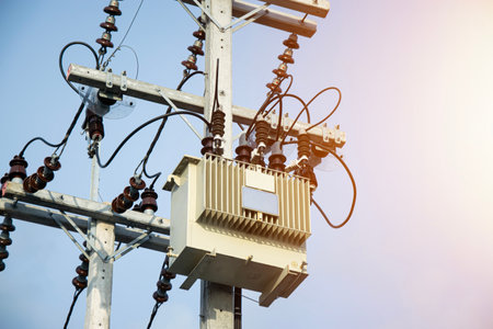 Large high-voltage transformers mounted on poles